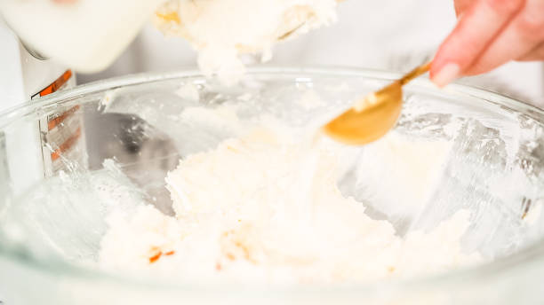 istock Mixing buttercream frosting for vanilla cupcakes. 1028050368