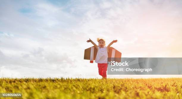 Girl Playing Astronaut Stock Photo - Download Image Now - Child, Flying, Running