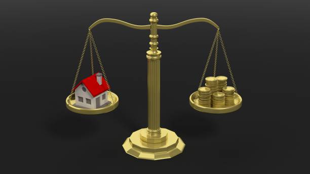 istock House and coins on scales 1028053156