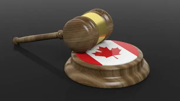 Photo of Canadian flag with court hammer