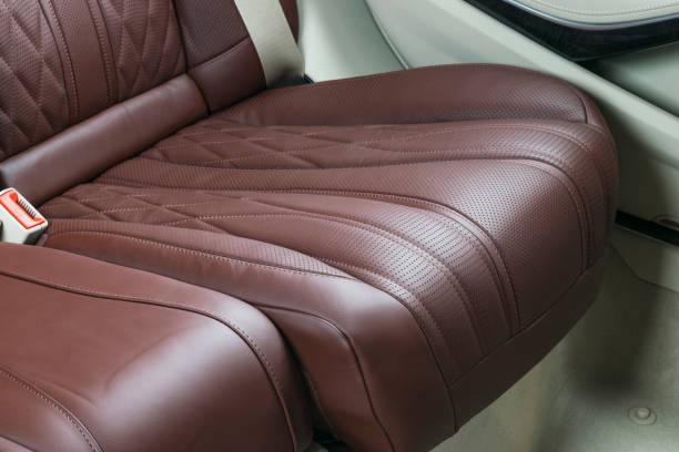 istock Car inside. Interior of a car. Comfortable leather Black seats. Black perforated leather. Car interior details. Car detailing 1028053542