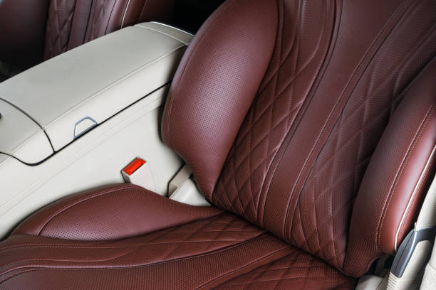 istock Car inside. Interior of a car. Comfortable leather Black seats. Black perforated leather. Car interior details. Car detailing 1028053654