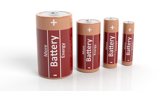 3D rendering of batteries in all sizes, isolated on white background.