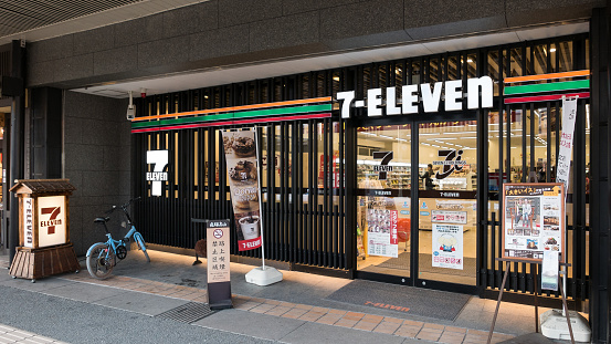 Takayama, Japan - February 16, 2017 - 7-Eleven store with a traditional Japanese facade. 7-Eleven is a Japanese-owned international chain of convenience stores.