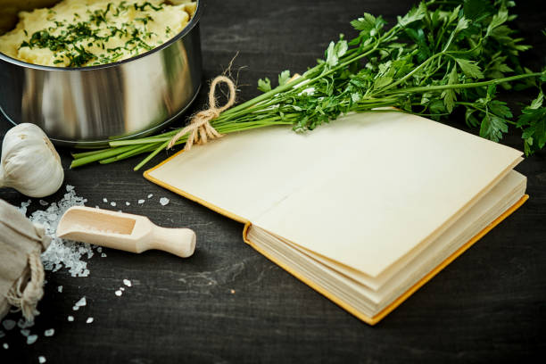 istock silver pot with delicious pure next to a recipe book on a black table 1028064830