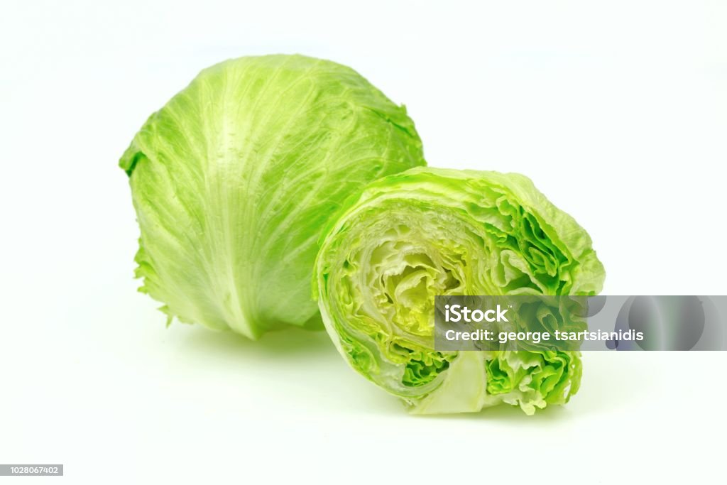 Iceberg lettuce and one cut half, on white background. Lettuce Stock Photo