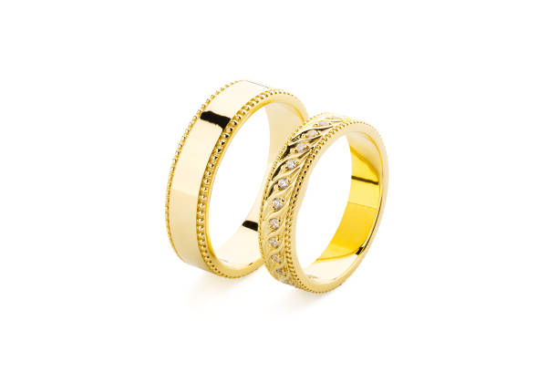 istock Gold wedding rings isolated on white background 1028067596