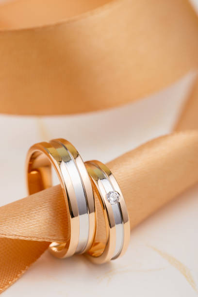 istock Two-tone wedding rings with ribbon 1028067602