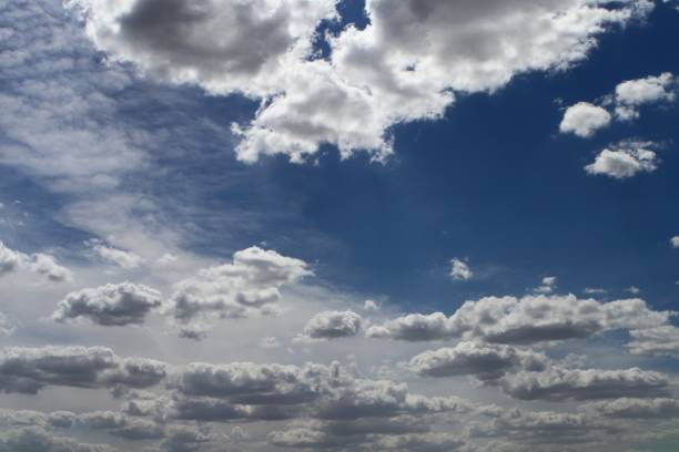 istock beautiful colorful light partially cloudy sky for using in design as background. 1028067630