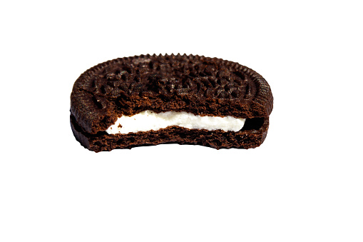 Bitten chocolate cookie with cream filling isolated on white background