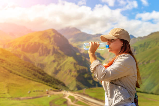 istock Woman drinking water in summer sunlight 1028071758