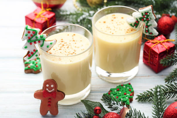 istock Eggnog in glasses with gingerbread cookies on wooden table 1028078046