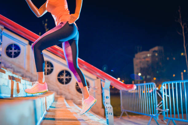 istock Fitness woman running up on steps 1028081280