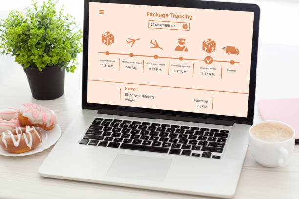istock notebook with package delivery tracking screen on  desk in office 1028081842