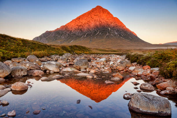 First Light on Buachaille Etive Mor Glencoe Scotland Autumn sunrise at Buachaille Etive Mor, perfectly  reflected in the Coupall River, Glencoe, Lochaber, Highlands, Scotland, UK. buachaille etive mor photos stock pictures, royalty-free photos & images