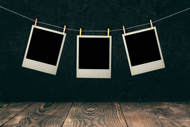 istock cards hanging on a thread on a black background 1028092422