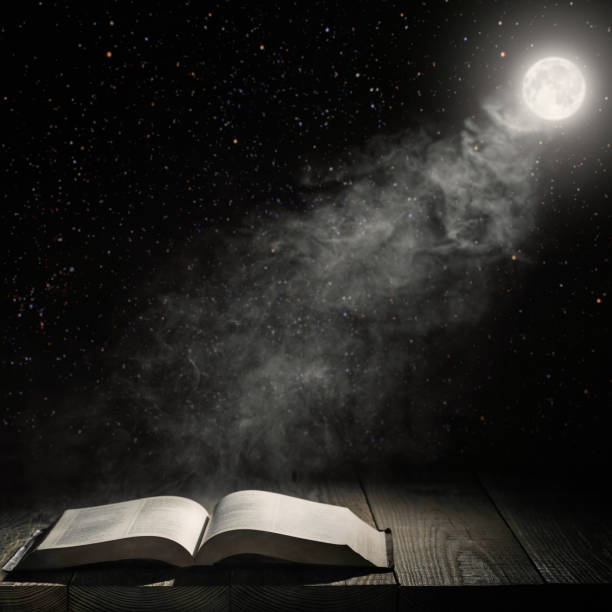 istock moon  shines on the book on the table 1028092484