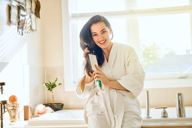 istock woman is combing hair 1028095862