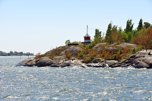 Lighthouse on rocky island of Helsinki archipelago, Finland