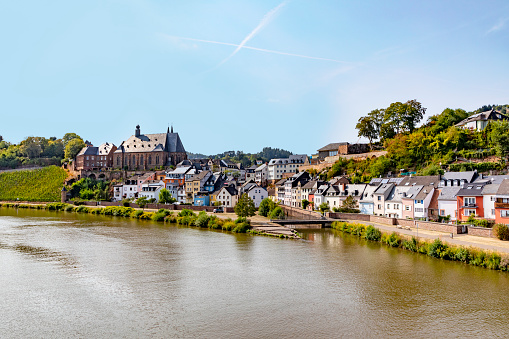 view on historic Marburg over Lahn river at blue summer morning with weir in the foreground and castle in the background