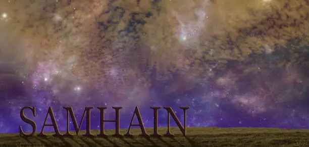 warm coloured starry cloudy autumnal night sky background with a simple grassy hilltop and the word SAMHAIN and copy space above