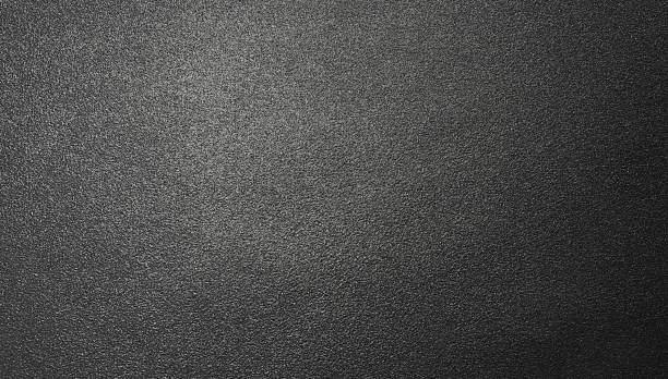 istock Background texture of shiny black metal foil 1028104272