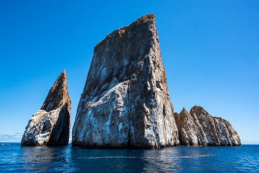 the famous Kicker Rock (Leon Dormido) at the north western coast of San Cristobal Island, Galapagos, Ecuador. Kicker Rock is one of the most visited touristic places and one of the best spots for snorkeling and scuba diving on the Galapagos Islands.