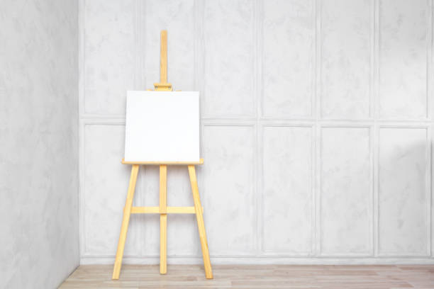 istock Wooden easel in the room 1028120012