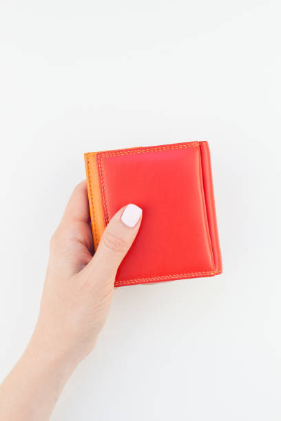istock Woman hand with red wallet isolated 1028120254