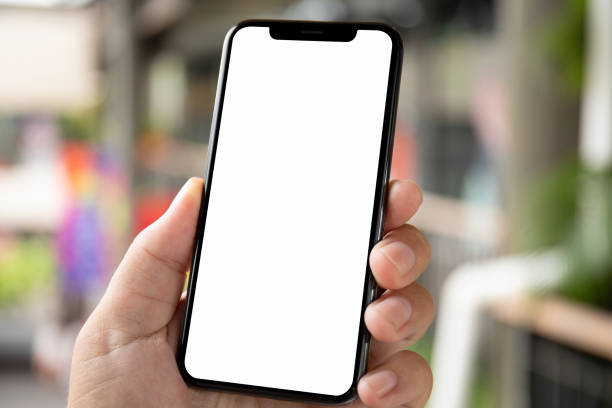 istock man hand holding phone with isolated screen on background city 1028122642