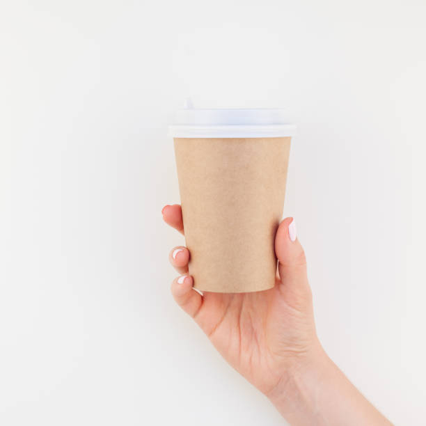 istock Mock up of coffee cup in female hand 1028122786
