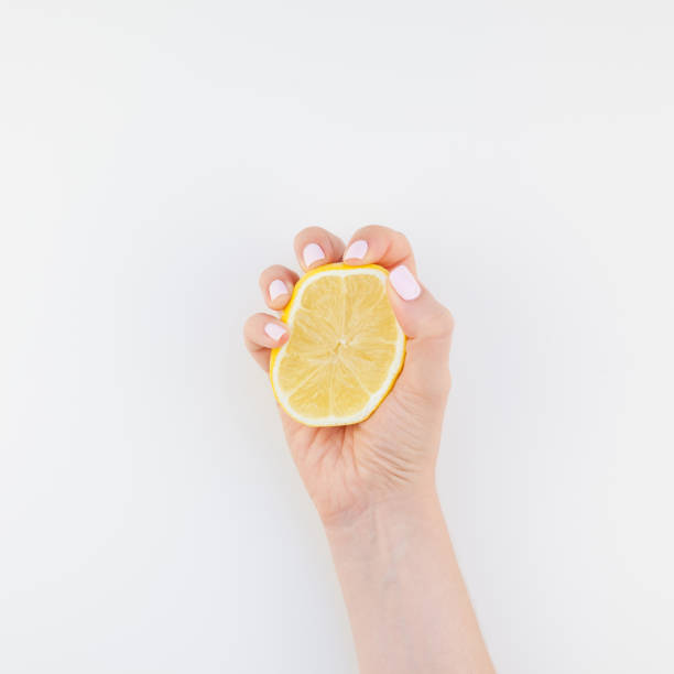 istock Woman hand with lemon 1028123080
