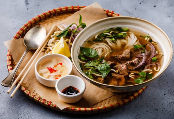 istock Pho Bo vietnamese Soup with beef in tray 1028123472