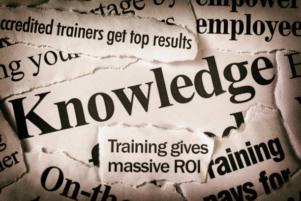 istock Newspaper headlines focusing on business training and education 1028123984