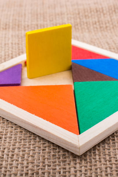 istock Pieces of a square tangram puzzle 1028127816