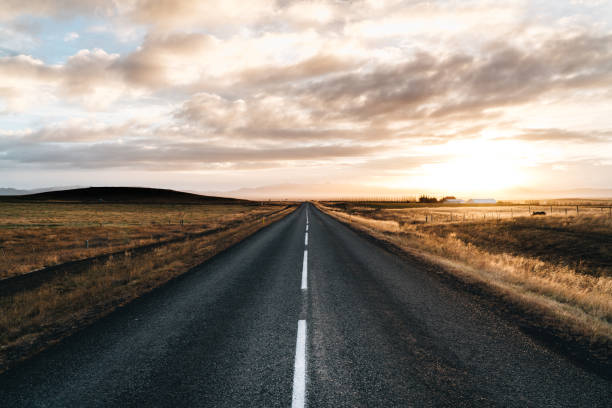 Never ending road till horizon on a sunrise sunset Never ending road till horizon on a sunrise sunset straight stock pictures, royalty-free photos & images