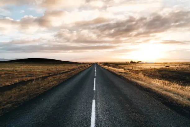 Photo of Never ending road till horizon on a sunrise sunset