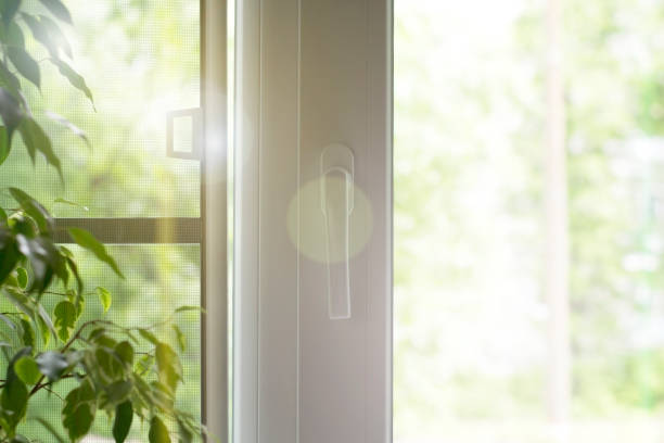 istock Window with a mosquito net. Plastic window with  the sunlight, background. 1028128138