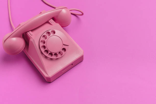 istock vintage phone on color background 1028128222