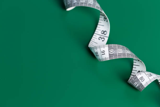 istock measure tape on a green background 1028132226