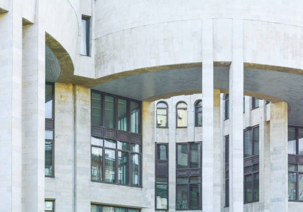 istock Urban city modern building with semicircular ledge with columns. Old town house 1028134878
