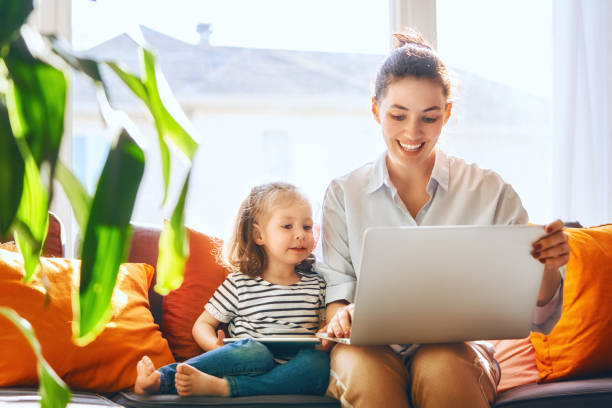 istock mom and child with laptop 1028142752