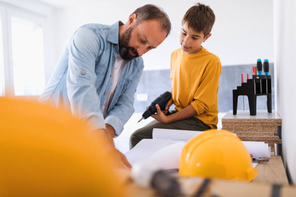 istock Father with his son working together 1028144142