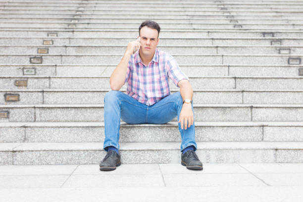 istock Serious pensive male freelancer concentrated on conversation 1028147722