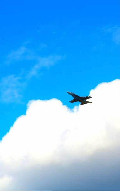 istock F/A-18 emerges from the clouds 1028168354