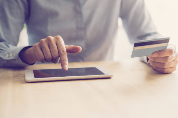 istock Closeup of Person Using Tablet for Online Shopping 1028170530
