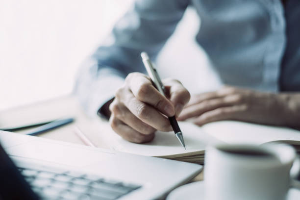 istock Closeup of Woman Making Notes in Office 1028170588