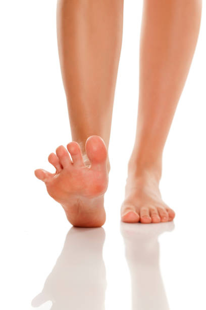 istock beautifully groomed bare feet on white background 1028171572