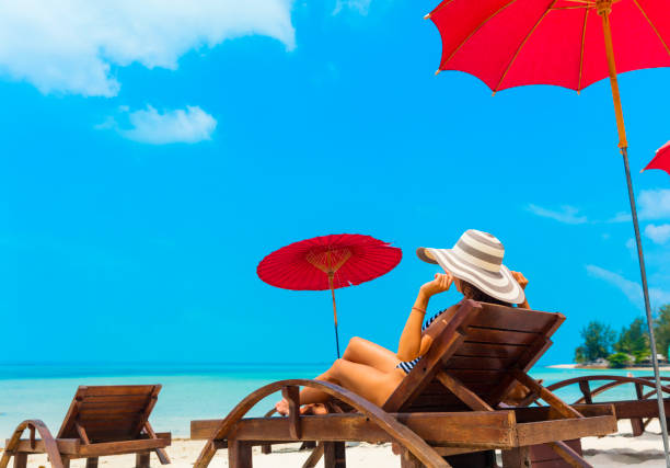 istock Woman in beach chair 1028177594