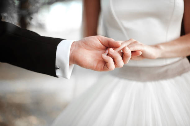 istock The guy romantically holds the bride's girlfriend by the hand 1028181310